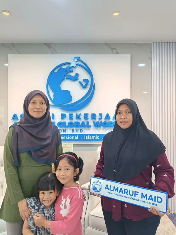 An employer with their new Almaruf helper on handover day